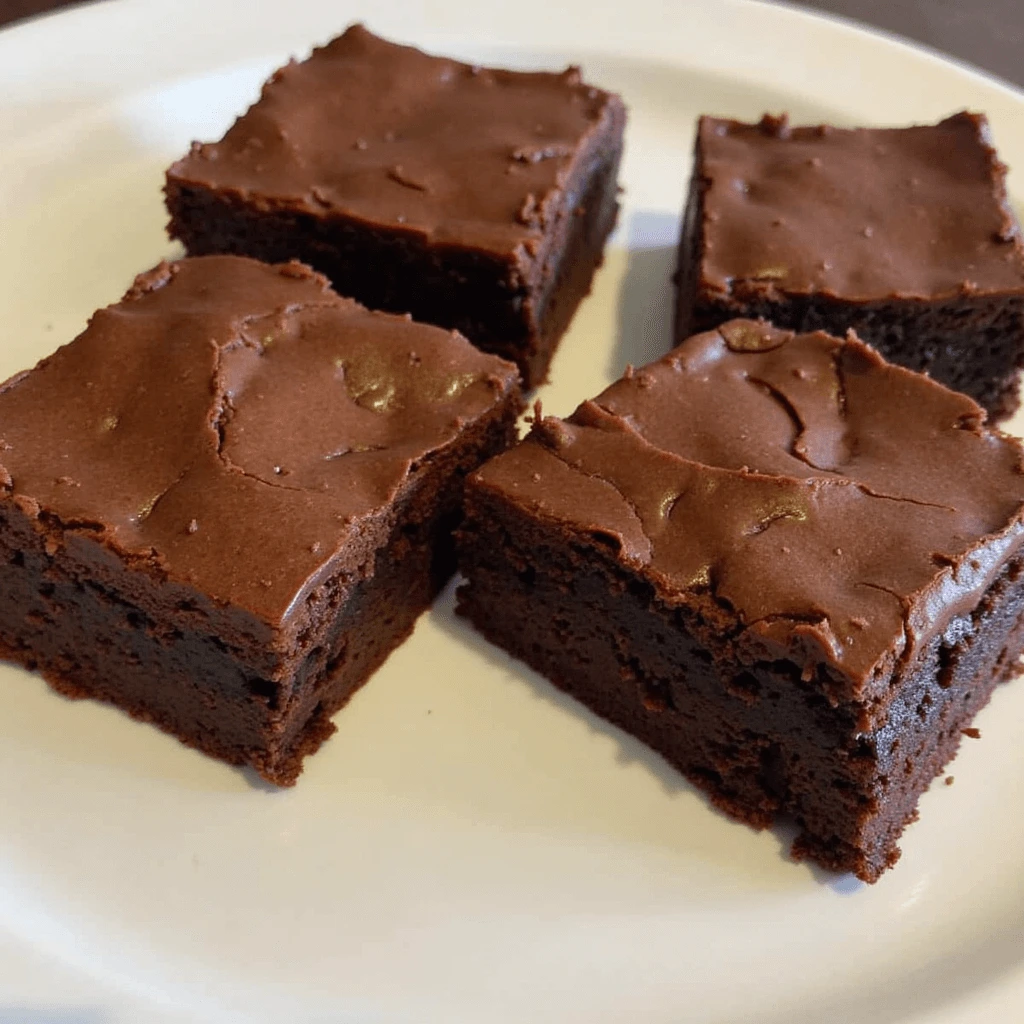 Fudgy homemade brownies fresh out of the oven, ready to be served.